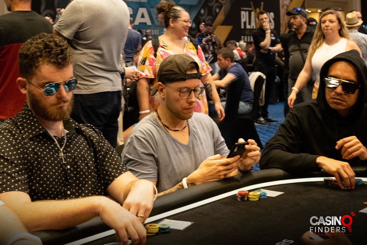 male poker players at a live poker table